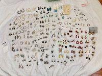 Full layout of entire earring collection on cloth
