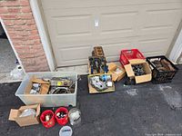 overall lot with engine block on dolly, totes and crates of parts