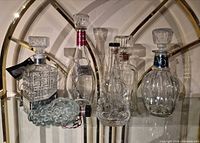 Group shot of all six glass decanters on shelf