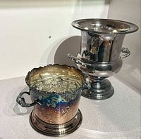 Both silver-plated buckets side by side showing relative sizes