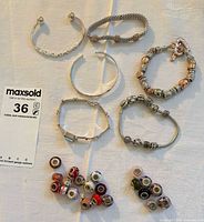 Overview of all bracelets and loose beads on table