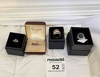 Group shot of four boxed rings