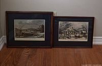 Both framed prints side by side on floor showing full frames