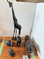 Group shot of all five wood animal sculptures