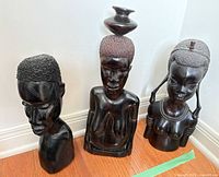 All three hardwood African busts side by side