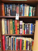 Full view of the three shelves showing quantity and variety of books