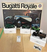 Full lot showing Bugatti Royale kit box and four diecast vehicles