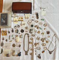 Overall view showing jewelry box and entire assortment of jewelry pieces laid out