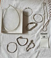 All eight jewellery pieces laid out for overview