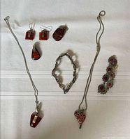 All six jewellery pieces laid out for overview