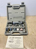 Full kit in open case showing die grinder and accessories