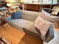 overall view of grey sofa with cushions
