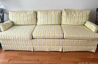 Front view showing full sofa, cushions and skirt