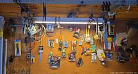 Full pegboard view with all hanging tools and packaged items