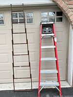 Front view of both ladders side by side showing overall height and design