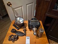 Group shot showing all five metal items on table