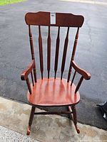 Front view of wooden spindle-back rocking chair
