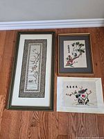 All three embroidered textile artworks shown together