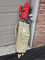 Bag standing with clubs, headcovers, balls