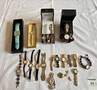 Group shot of all 18 wristwatches laid out on table