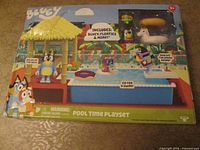 Front of sealed Bluey Pool Time Playset box