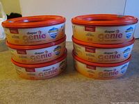 Front view of six Playtex Diaper Genie refill cartridges stacked