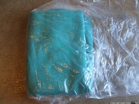 Fabric folded, in plastic bag