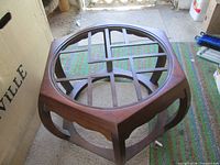 Wood base showing lattice support and curved legs