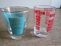 Front view of both jiggers showing measurement markings