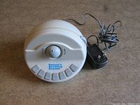 Front view of sound machine with AC adapter