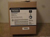 Front of Ridgid 12V charger box showing branding and specifications
