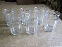 All six glass tumblers upright on tabletop