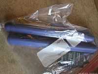 Two purple Starbucks straws inside clear plastic bag