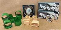 Group shot of all napkin rings, Chokin plate box, and silverplate boxed sets