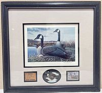 Full view of framed display showing print, stamp, plaque, miniature goose
