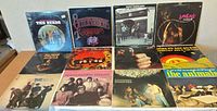 All 12 LPs laid out in three rows