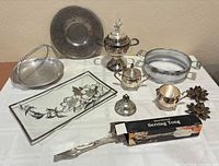 Group shot of all silver-plated pieces, glass tray and boxed tongs