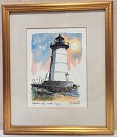 Full view of framed print showing artwork, mat, and gold frame