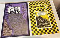 Both posters side by side showing full artwork