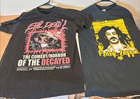 Both T-shirts side by side showing full fronts and graphics