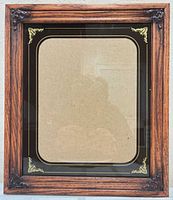 Full frontal view of wood frame with inner liner and glass