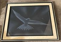 Front angled view of framed dove artwork under glass