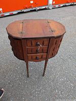 Front view of solid wood sewing cabinet closed