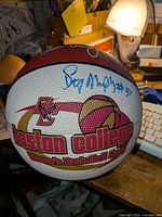 Overall view of Boston College commemorative basketball front panel with logo and blue signature