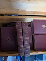 Harvard Classics volumes showing spines of vols. 33 and 49 in maroon cloth