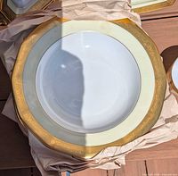 Large rim soup bowl showing gold border detail