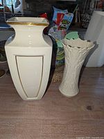 Both Lenox ivory porcelain vases side by side on tabletop