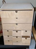 Stacked view of all three plywood organizers showing drawer configurations
