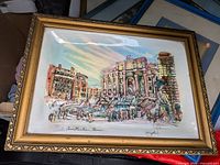 Framed watercolor cityscape of Trevi Fountain, showing frame style and signature