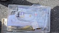 Clear storage bin with packaged tackle and rope